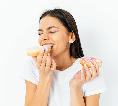 woman eating donuts